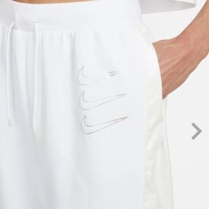 NIKE NWT OPAL Fleece Womens Joggers size XL. Silver Swoosh and faux leat…